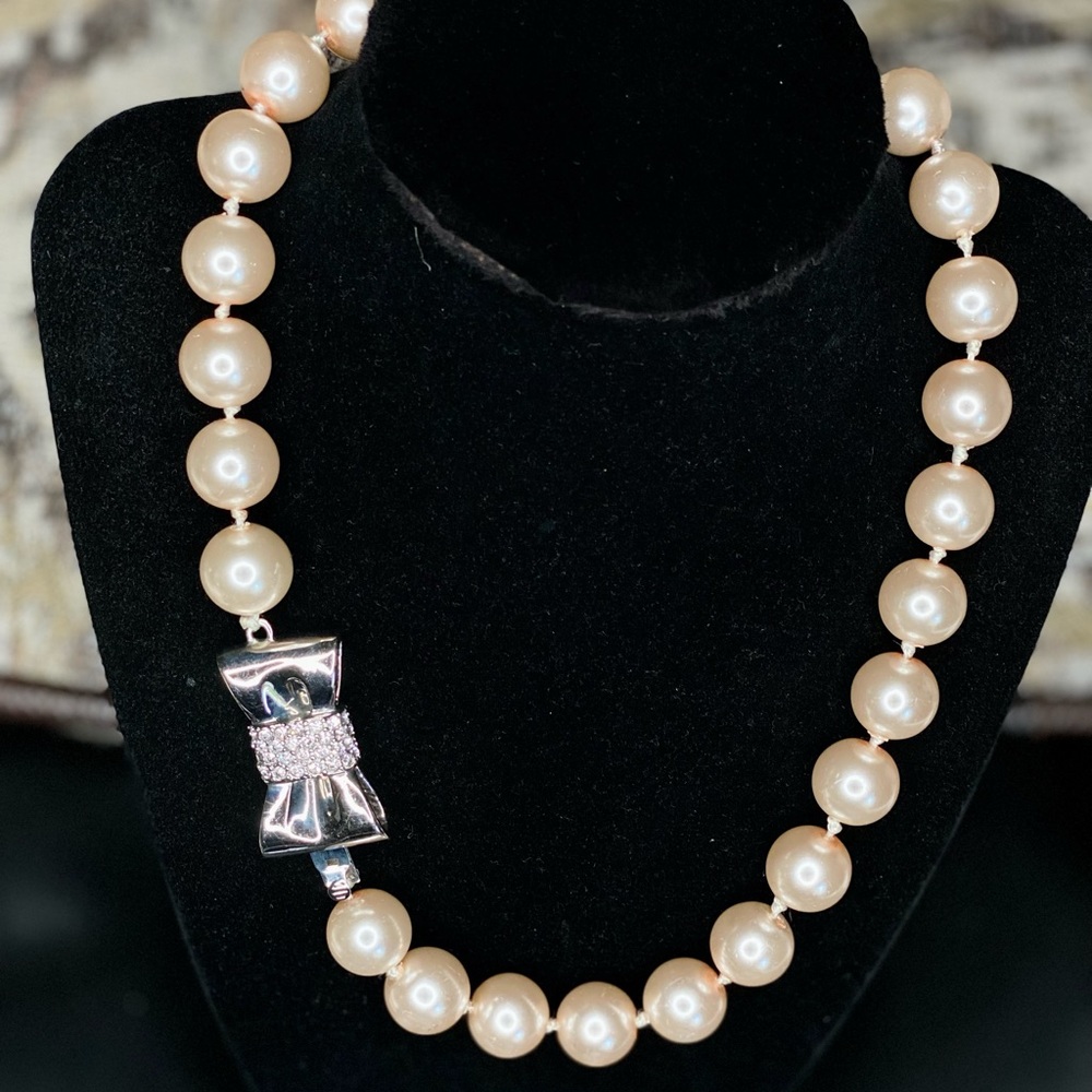 Pink Faux Pearl Necklace with Silver bow Crystal Clasp.